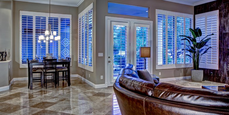 Orlando great room with white shutters and modern lighting.